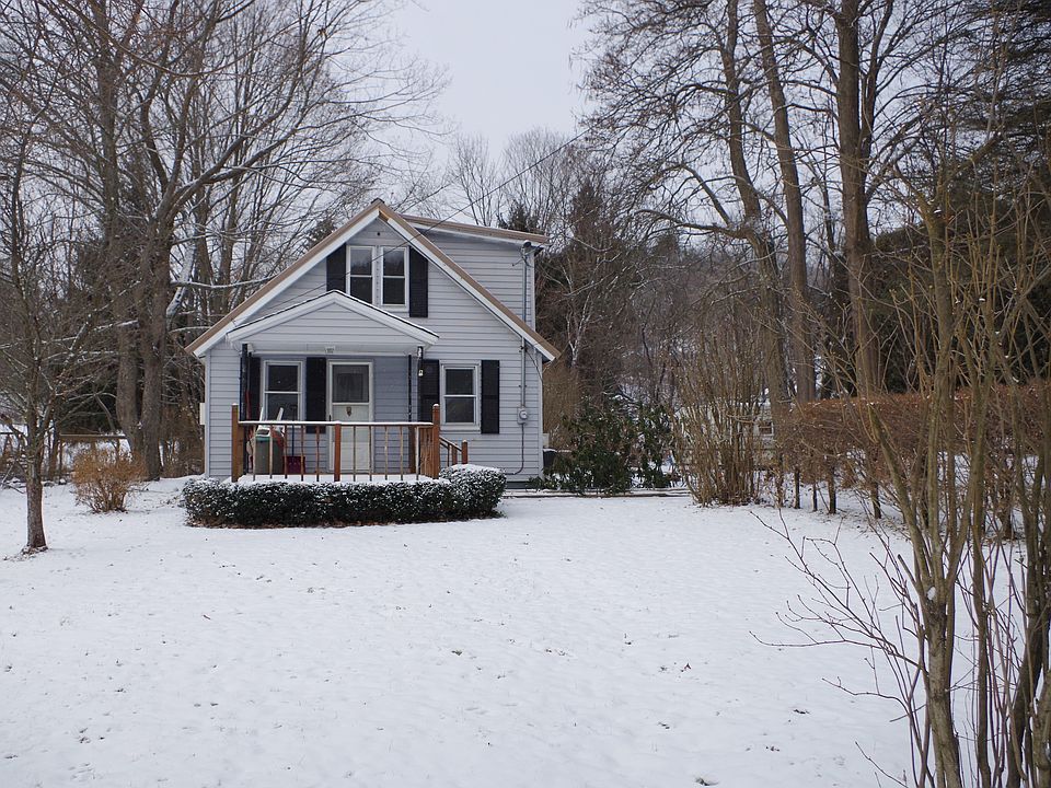 Home sits behind garage 