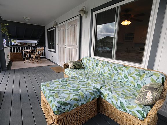 Your front lanai with couch and cafe table.