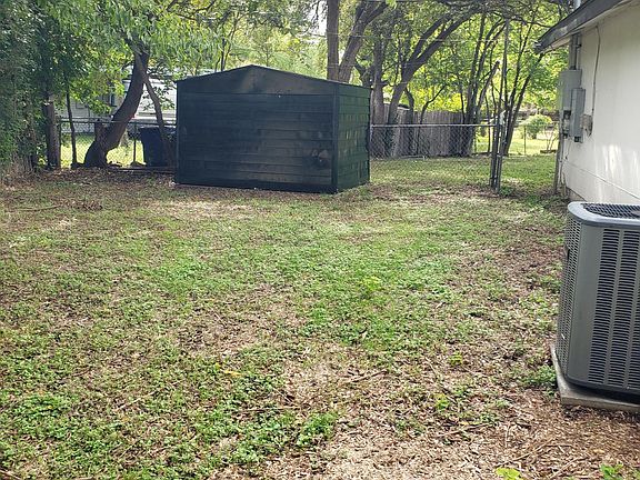 2nd storage shed backs to side yard.