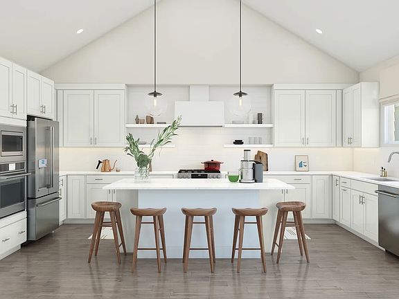 Kitchen with vaulted ceiling and pendant lighting