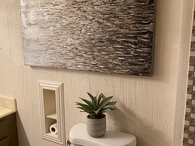 Art over the toilet.