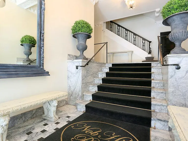 Nob Hill Place ~ Timeless entry with marble stone flooring and beautiful ceiling chandelier lights