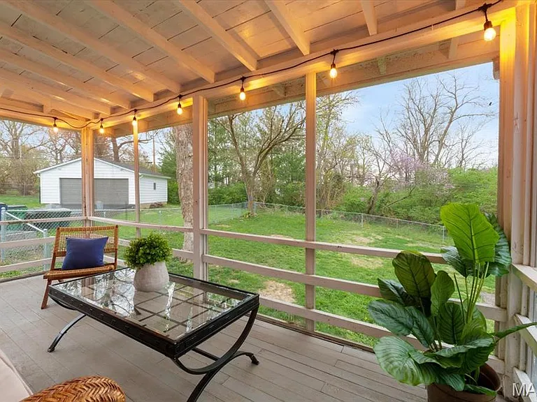 Screened back porch off kitchen.