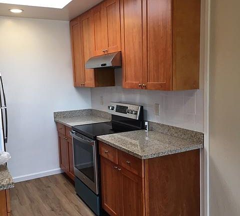 kitchen with stainless stove electric glass top