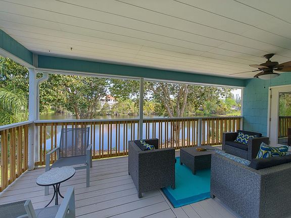 Covered porch overlooks lake