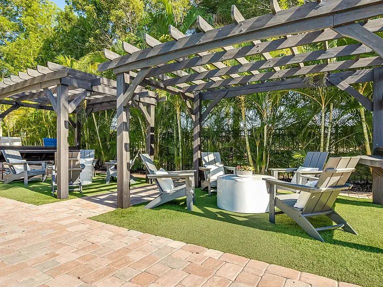 Relax in shaded comforts beneath our poolside pergolas.