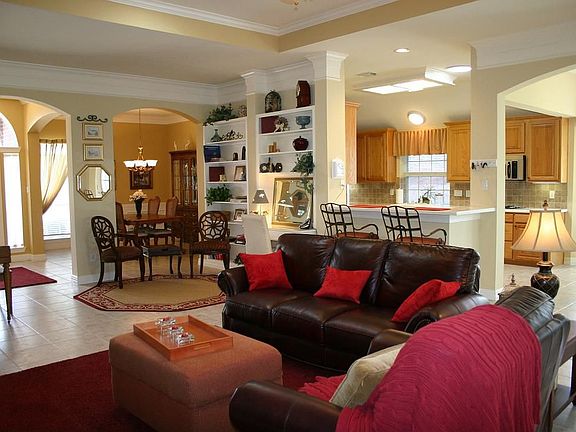 Open floorplan with high ceilings, 18" tile floor, & direct vent fireplace