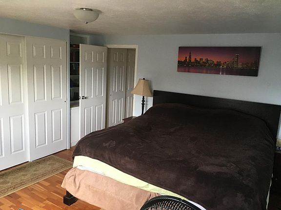 Bedroom has built in bookshelf and extra storage