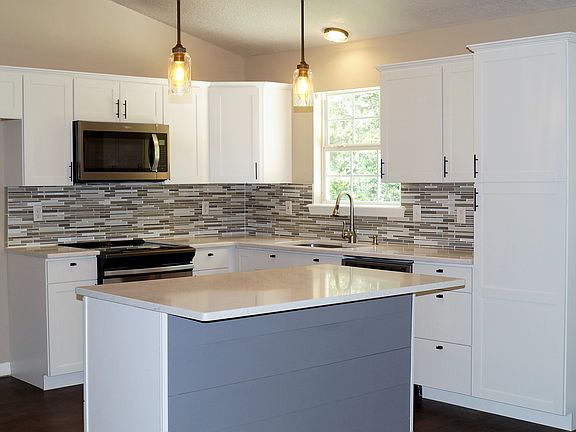 Kitchen opens to living area