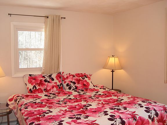 King bed with creek view