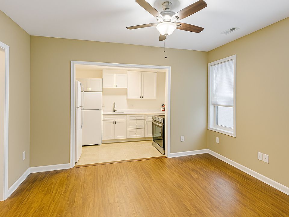 View without furniture. The room to the left in this picture is the entrance room/front door. Note- there is a window above the kitchen sink and not 2 fridges - the appliance to the left are stackable washer/dryer shown in the next picture