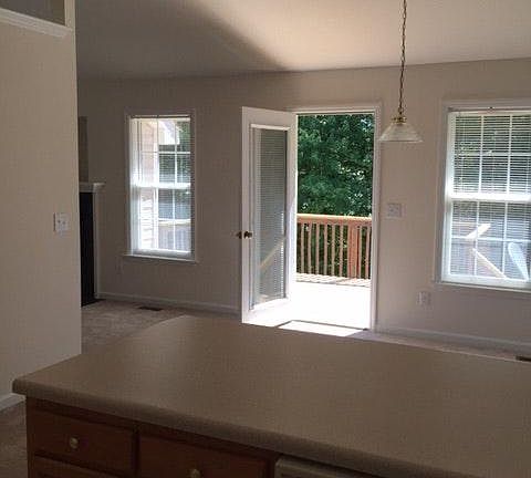 View to breakfast nook and deck from kitchen.