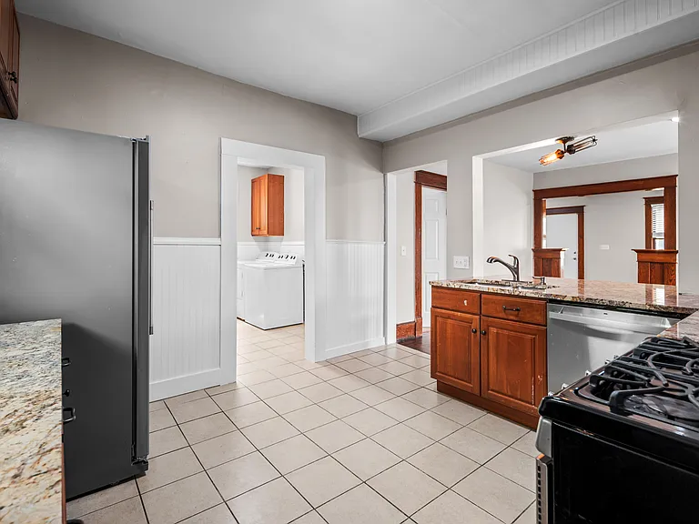 kitchen has stainless steel appliances and granite countertops