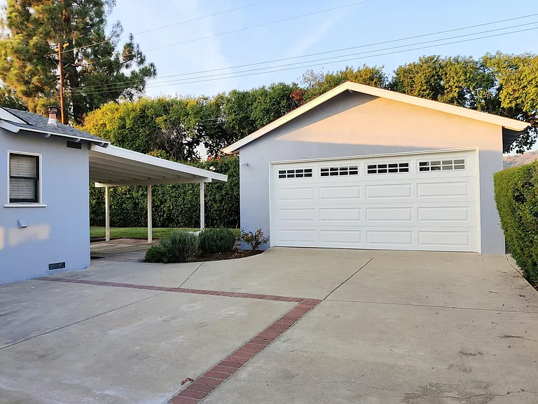 Detached garage with automatic garage door opener. Covered patio in rear yard.