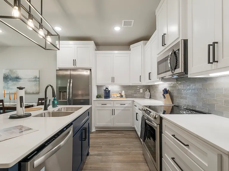Kitchen is fully stocked with all appliances, cookware, bakeware, etc. Oven is electric