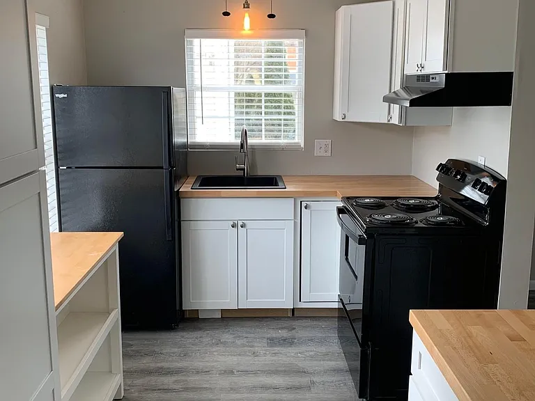 Kitchen - includes refrigerator, stove, disposal & lots of storage