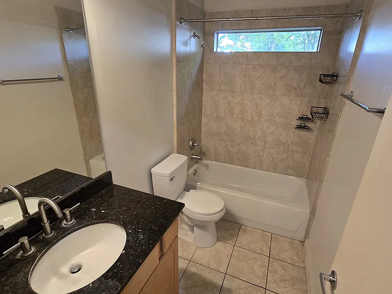 Downstairs bathroom with shower and bathtub.