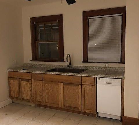 tiled eat-in-kitchen with dishwasher