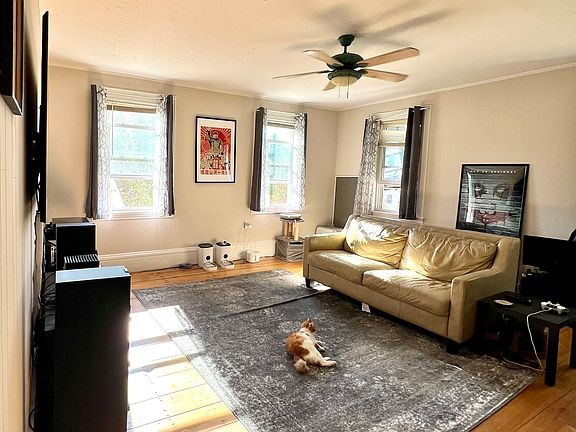 Spacious, sun filled living room, original wide plank wood flooring (15 foot by 15 foot)