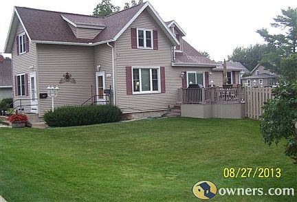 side of house and deck and fence