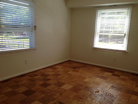 Bedroom with newly refinished floors and newer paint.