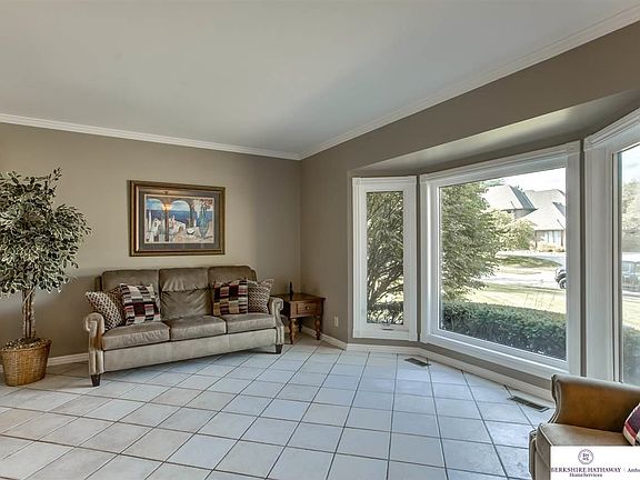 Spacious Formal Living Space with Tile Floors & Beautiful Bay Window