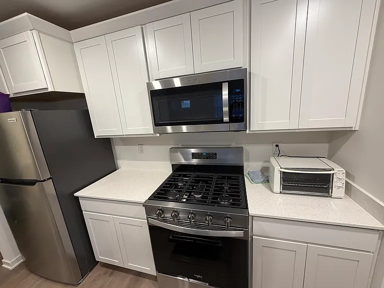 Kitchen includes: Gas Range/Oven, Refrigerator, Built-In Microwave, Dishwasher, and Pantry