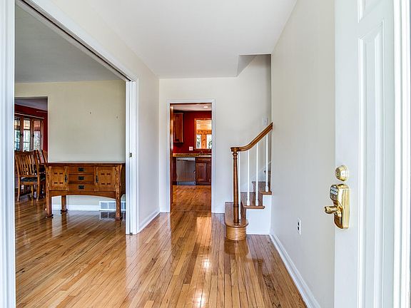 Entryway leading to living room and kitchen