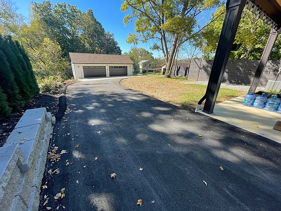 View from driveway toward back yard of 2314 and new garages. Privacy fence will extend down to the garage soon.