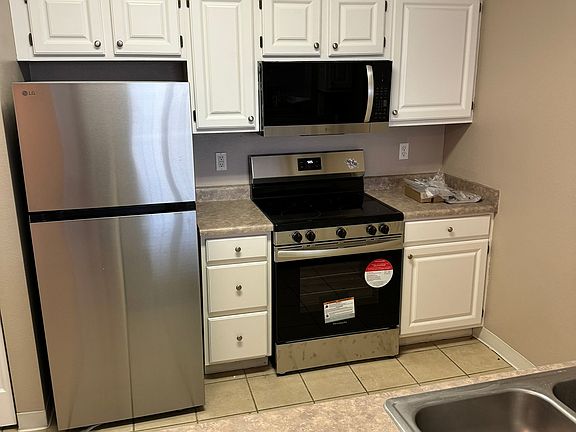 Kitchen has new appliances.