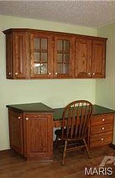 Desk/office area with even more cabinets!