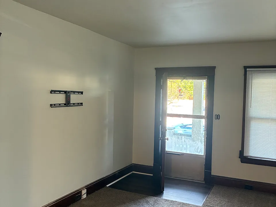 Front entrance and living room. Front porch. New carpeting. New paint, new flooring, complete renovation.