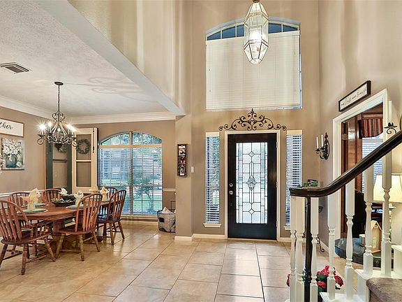 TWO STORY ENTRY WITH LEAD GLASS FRONT DOOR