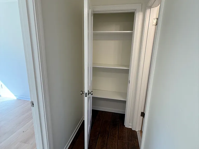 Linen closet at the end of the hallway.