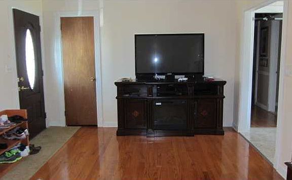 Living room with gleaming hardwood floors