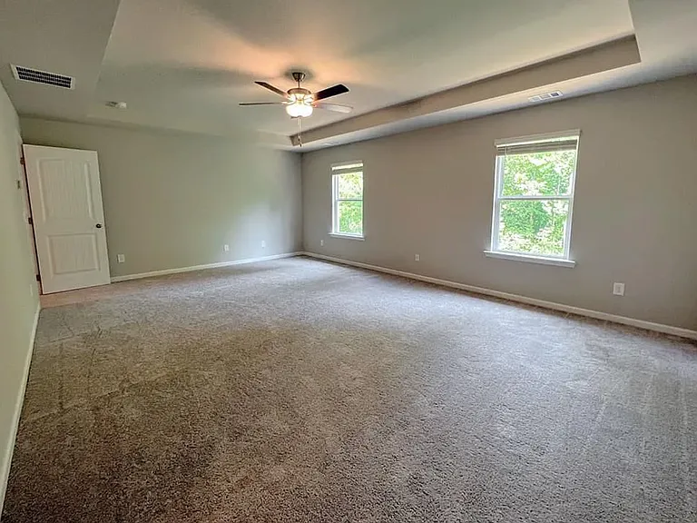 Here is the Master Bedroom with a beautiful view of nature from windows and with master bath, Closet and one linen pantry room with door inside the master bathroom only.