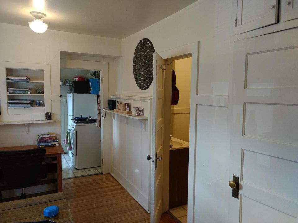 Main room with kitchen and bathroom beyond