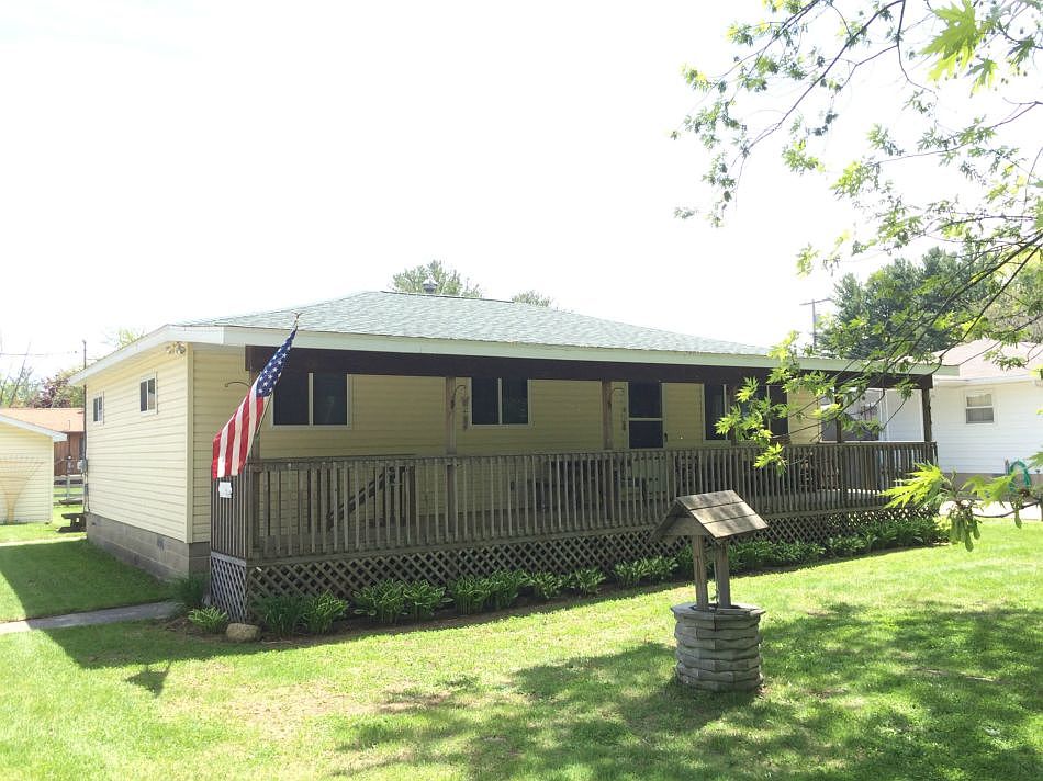 3 bedroom 1.5 bath Ranch located just outside of the village of Port Austin. It has Updated windows, Siding, roof and Furnace with AC. Large Detached 2.5 car garage and a deeded beach access just a short walk away. The family room has a fireplace with an insert. The front porch is a great place to relax and watch the world go by.