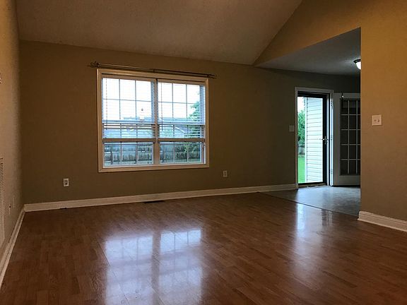 Living room with rear door to backyard