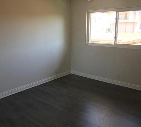 Second Bedroom with New Flooring and beam ceilings