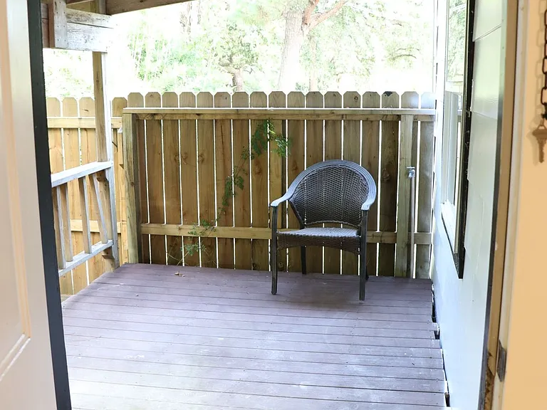 Private porch connected to the primary suite for outdoor enjoyment.