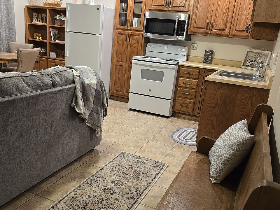 Full kitchen with electric stove, full size refrigerator and plenty of cupboards.
Stocked with dishes, utensils and pots/pans