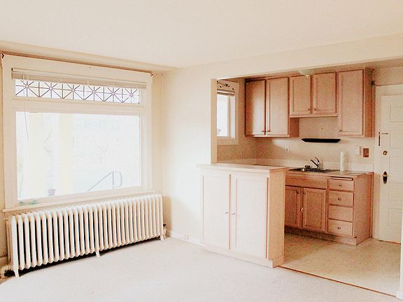Light and bright living room open to kitchen