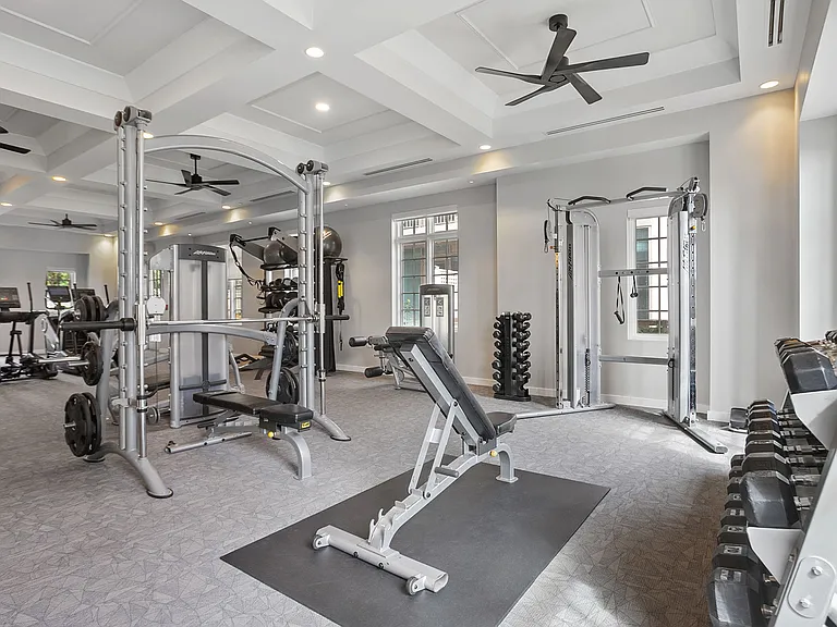 A bright, fully equipped fitness center designed to energize your routine, featuring modern equipment and an open, welcoming atmosphere for workouts that fit seamlessly into your day