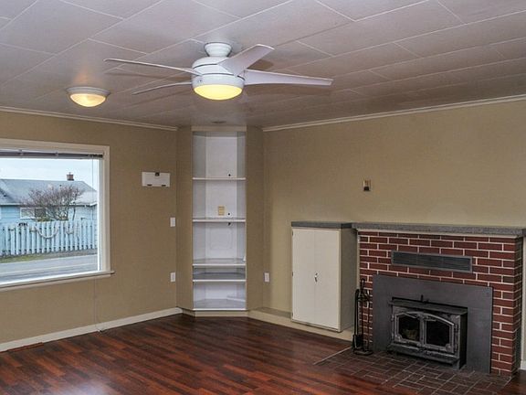 Wood burning fireplace and built-ins through-out. New flooring and interior paint.