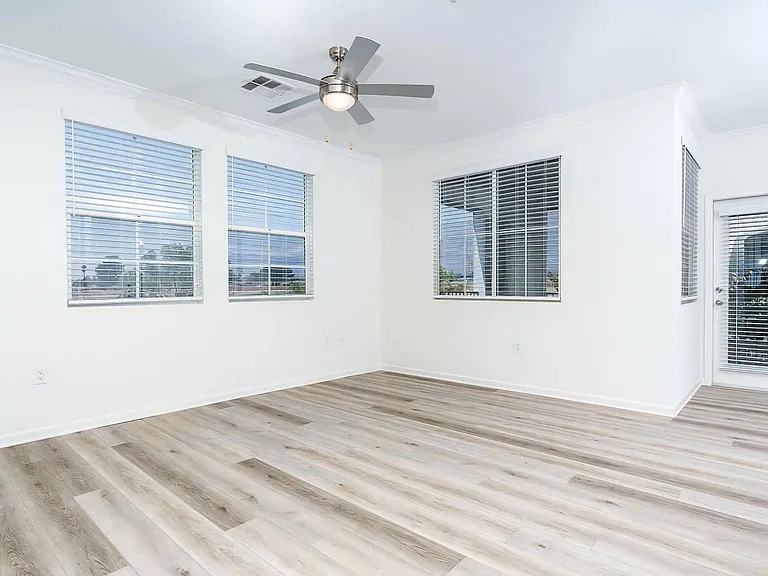 Open Living Space with Multiple Windows and Fresh White Walls