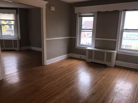 Dining room with two windows right between living room facing Haddon Avenue and the open kitchen on the other side