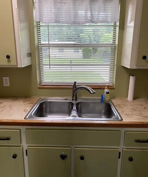 View of front yard through kitchen window