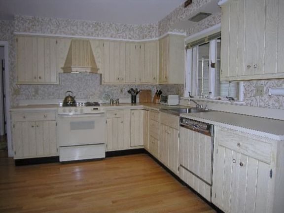 Large kitchen with hardwood floor.