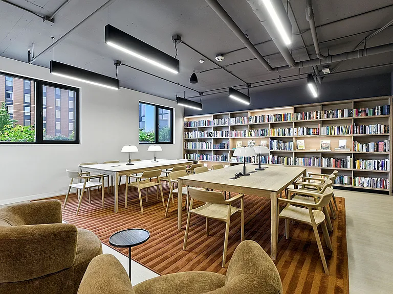 Cozy up in the communal library with a good book